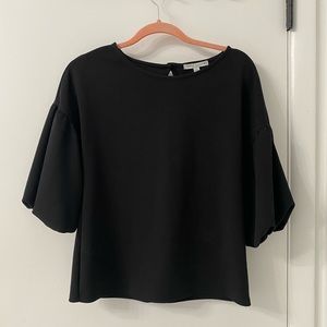 Black top with statement bubble sleeves
